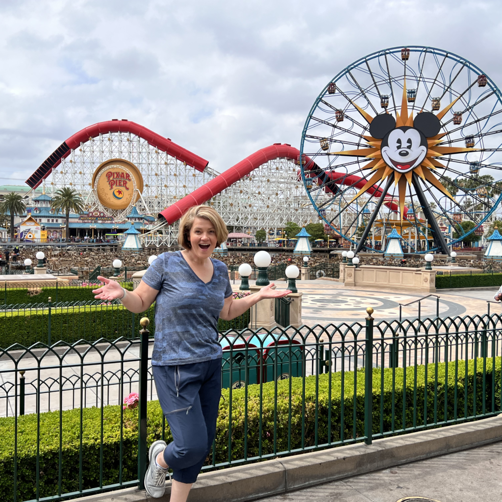 Rebecca in front of the Mickey Farris Wheel